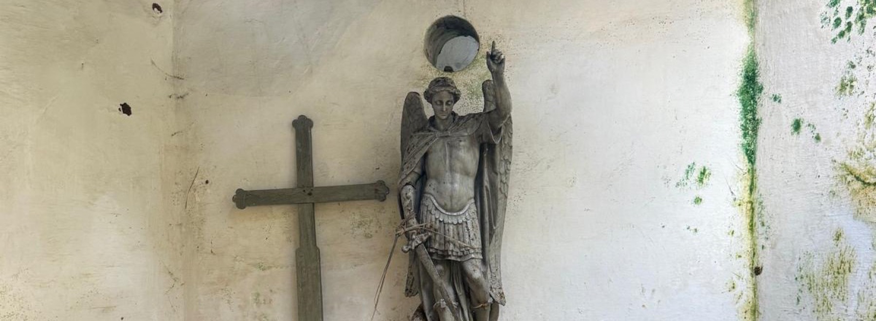 Statue and wooden cross